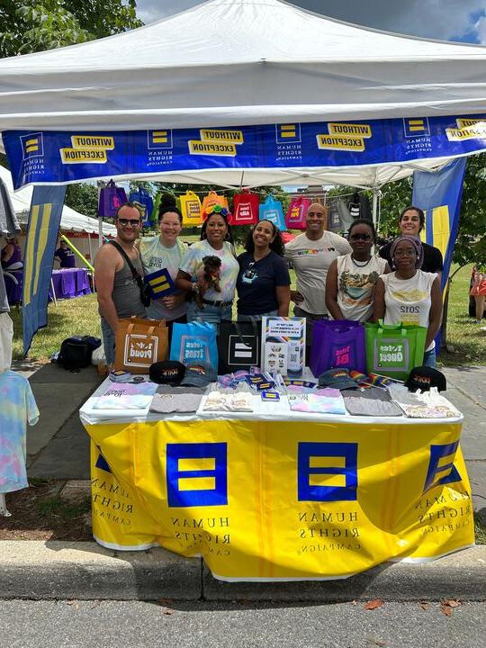 Human Rights Campaign team members at an event booth