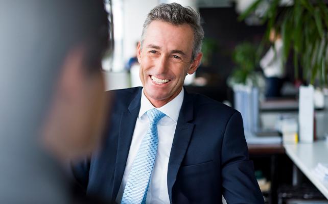 A potential investor sitting at a desk